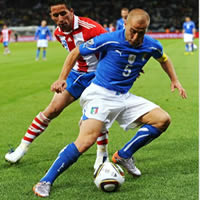 Italy averts major upset